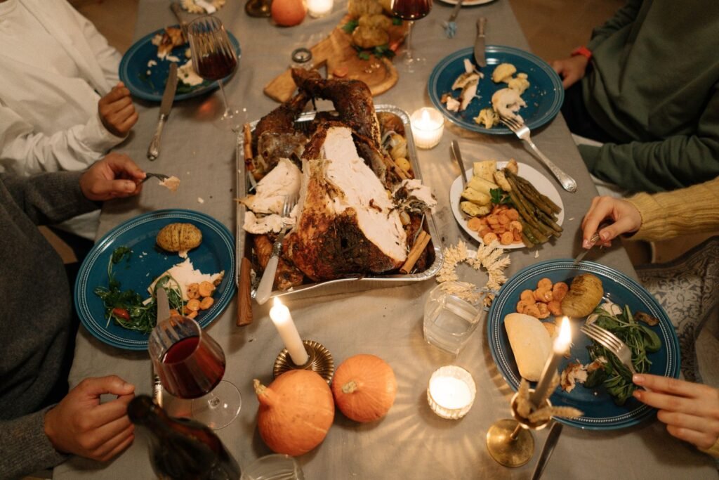 Top view of a cozy holiday dinner with a roasted turkey centerpiece