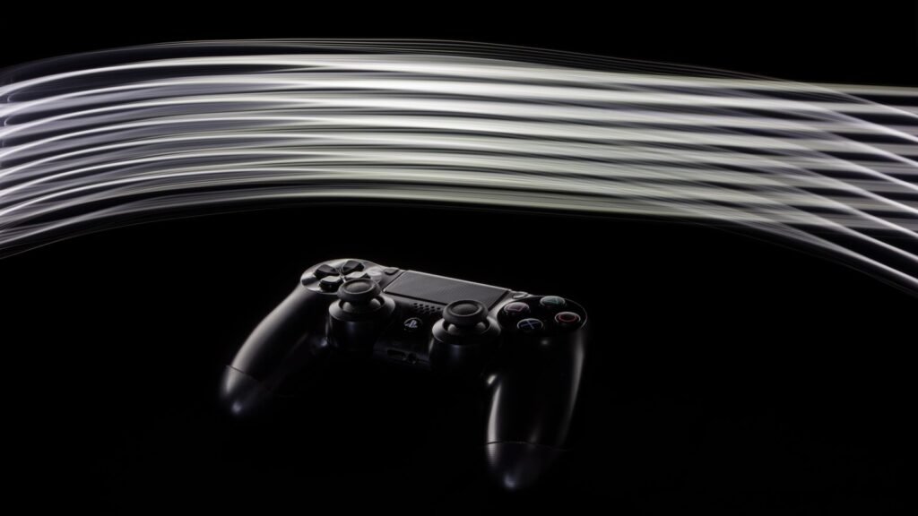 Close-up of a PS4 controller with dynamic light streaks on a black background