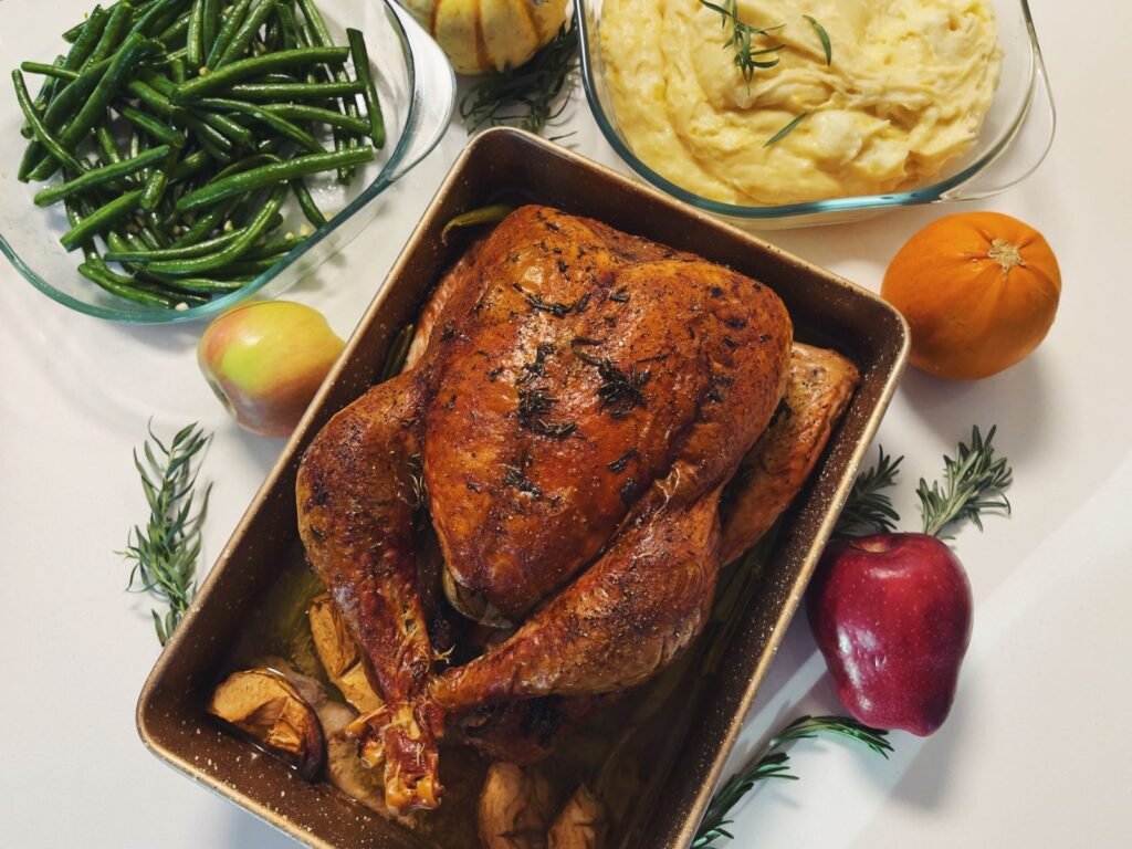 Delicious Thanksgiving roast turkey dinner with sides on a festive table